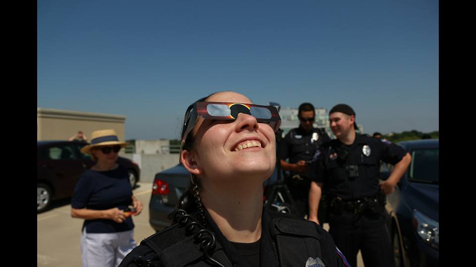 Officer Kimrey watching the solar eclipse